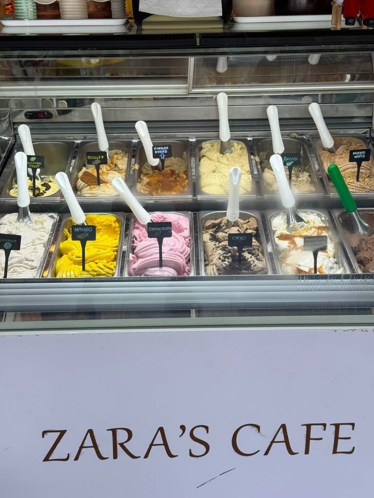 Gelato display with passion fruit, mango, strawberry, and other flavors