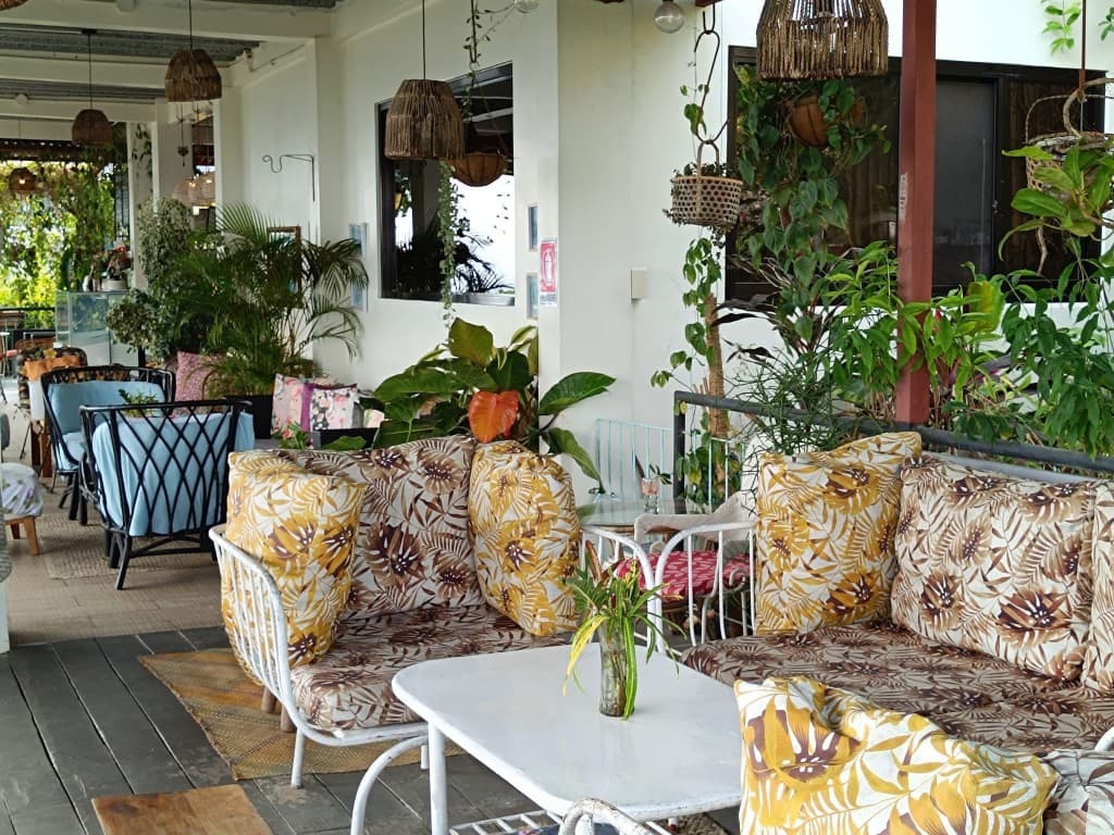 Tropical outdoor seating area at Zara's Cafe